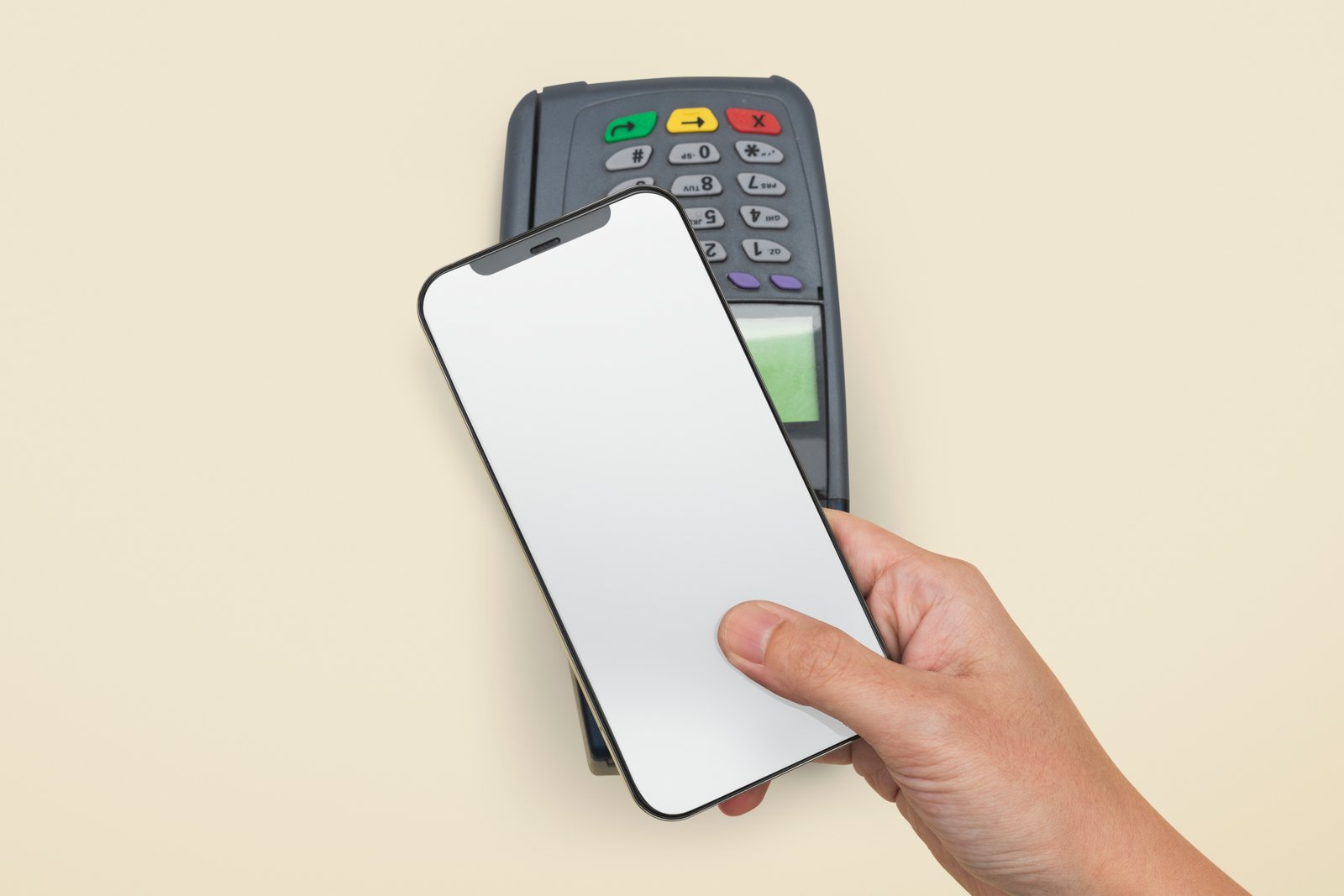 Hand holding a smartphone tapping a card reader for payment. The smartphone screen is blank. Beige background. Payment terminal buttons visible.