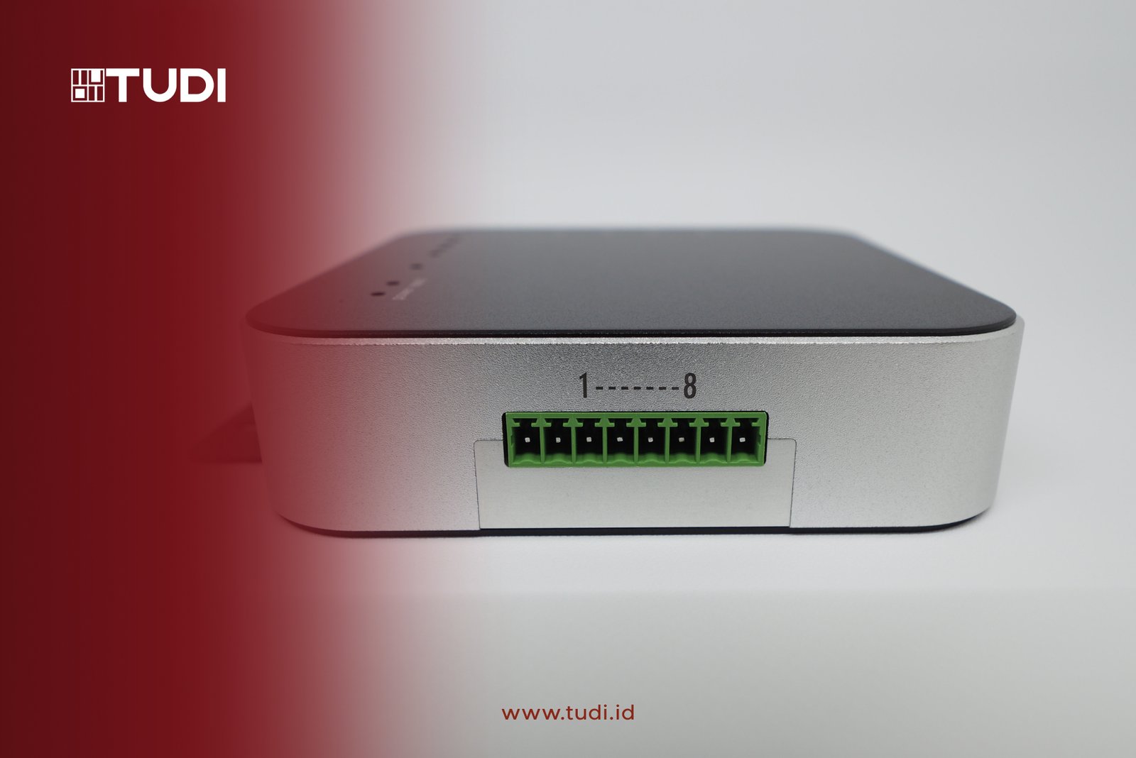 Silver electronic device with green ports (GPIO) labeled 1-8. Red gradient on the left. Logo "TUDI" and website "www.tudi.id" visible.