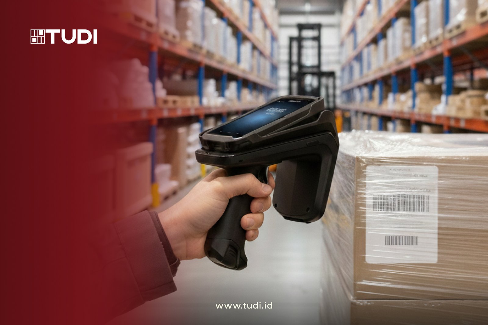 A person scans a barcode on a box using a handheld device in a warehouse. Shelves filled with boxes line the background. Visible text: TUDI, www.tudi.id.