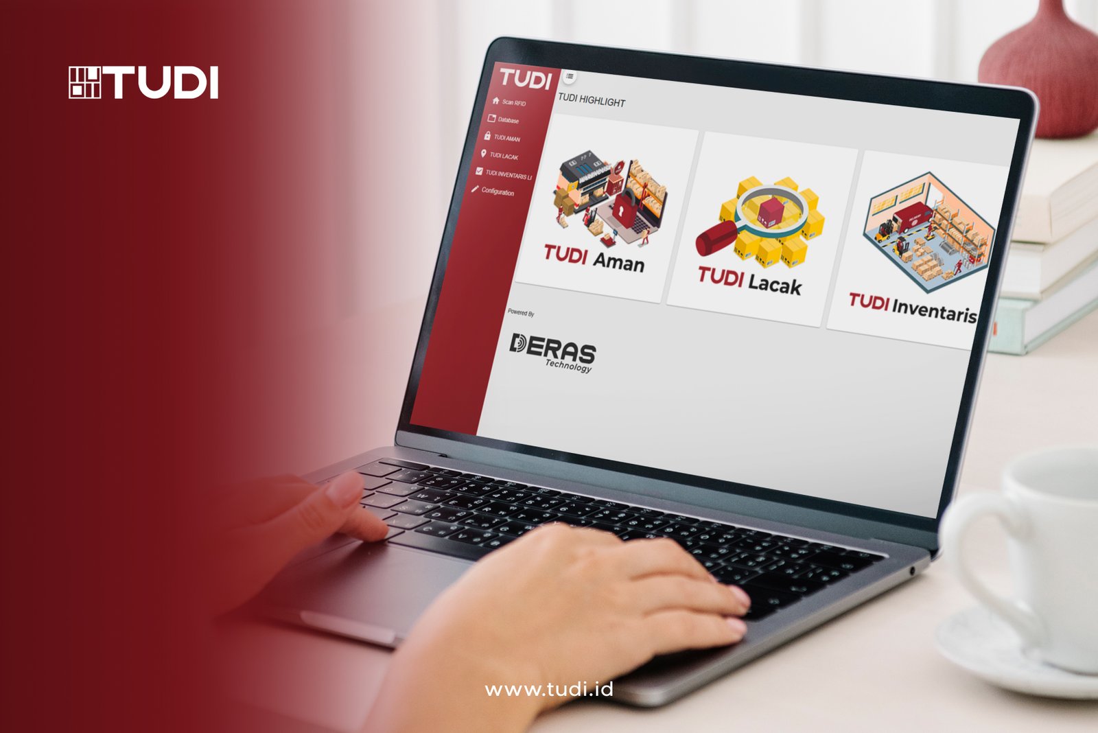 Hands type on a laptop with TUDI website open, displaying options: Aman, Lacak, Inventaris. Red and white design, cup nearby.